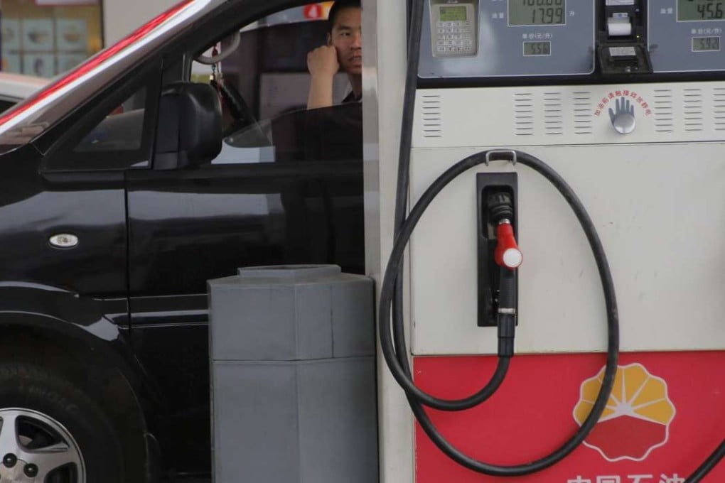 A customer waits in a car while his car is fueled at PetroChina's filling station in Beijing, China. A heated debate has erupted over plans by China to push ahead with technology to turn coal into gas. Photo: Reuters