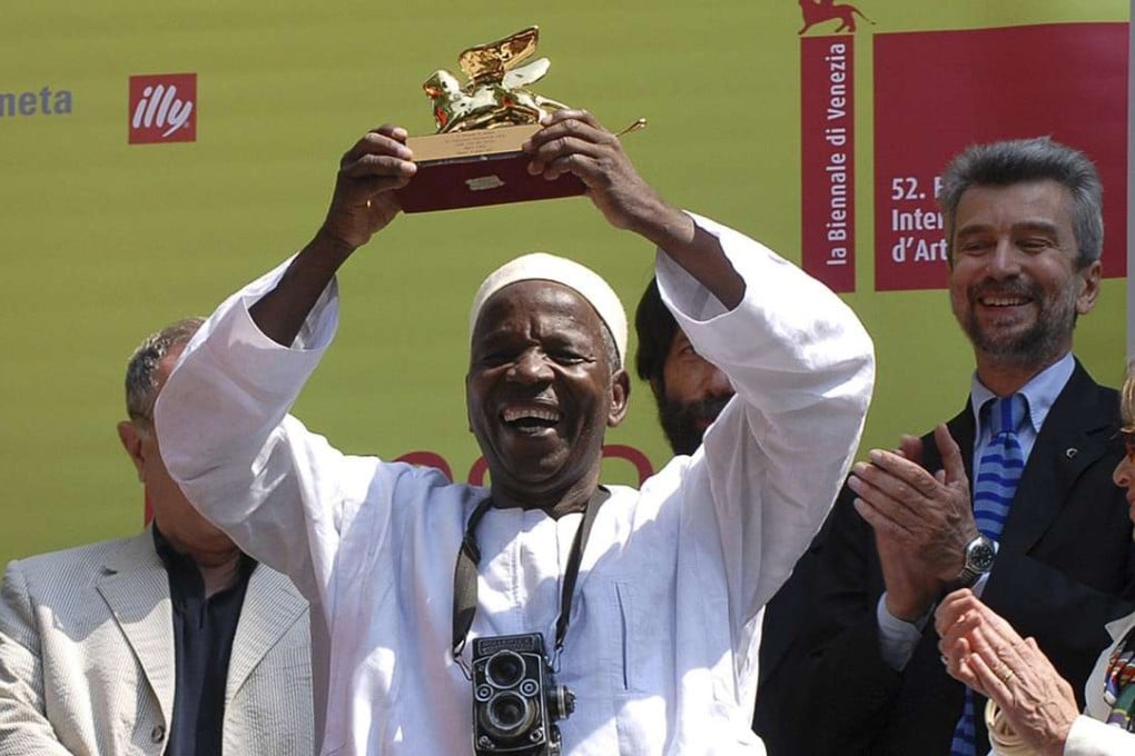 Malick Sidibe with the Golden Lion prize he was awarded at the 52nd Venice Biennale International Art Exhibition in Venice. Photo: AP