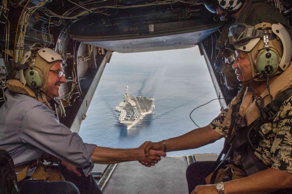 US Secretary of Defence Ash Carter and Philippine counterpart Voltaire Gazmin depart the USS John C. Stennis. Photo: AFP