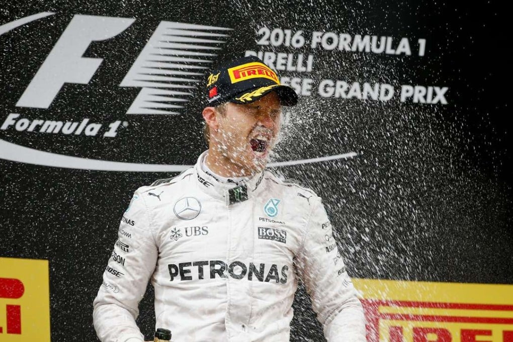 Nico Rosberg of Mercedes AMG GP is sprayed with champagne after winning the Chinese Formula One Grand Prix. Photo: EPA