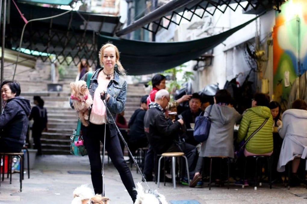 Suzette Ackermann with her dogs Snowball (white), Martini (brown) and Sambuca. Photo: Nora Tam