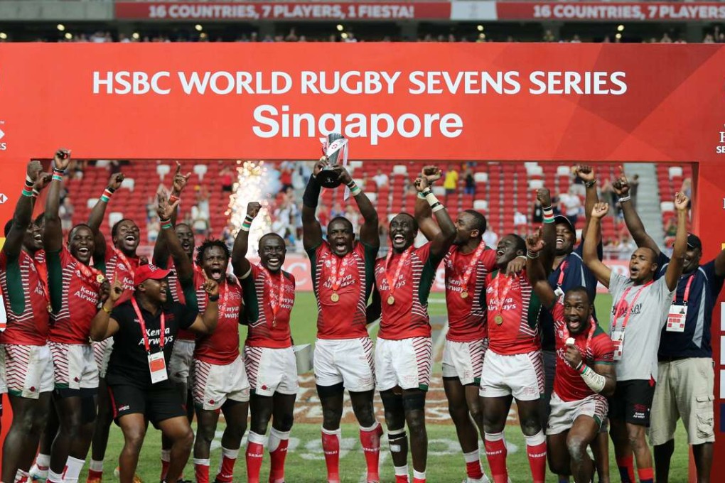 Kenyan players celebrate with the trophy after winning the 2016 Singapore Sevens on Sunday. Photo: Reuters