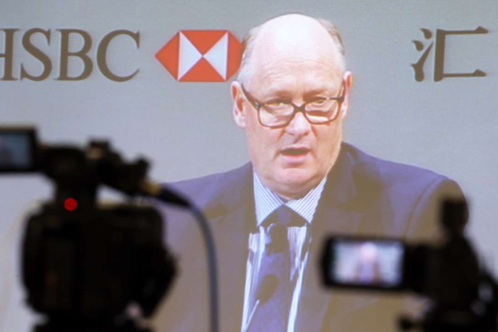 HSBC Chairman Douglas Flint appears on the live video stream during the bank’s informal shareholders meeting in Central on Monday. Photo: Nora Tam