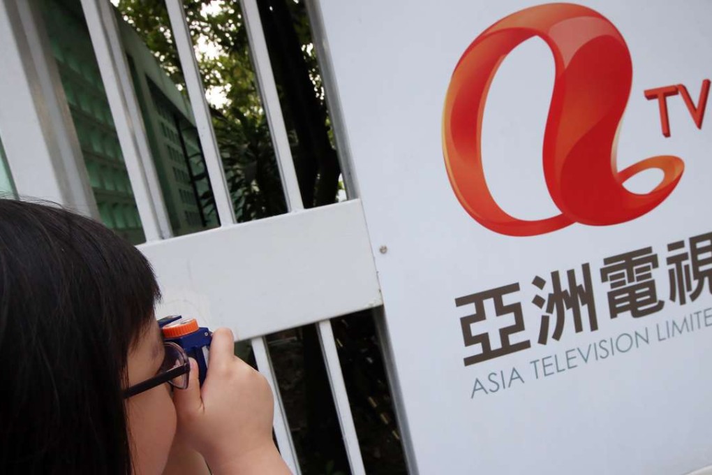 People taking pictures outside ATV Headquarters in Tai Po. Photo: David Wong