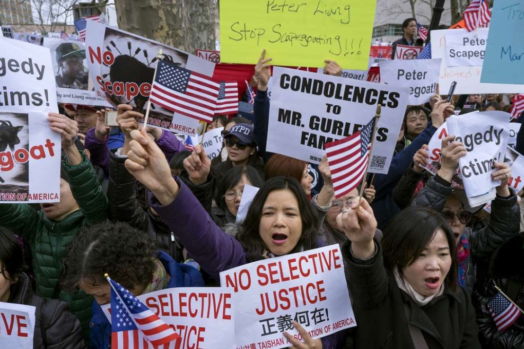 Chinese American protesters attend a rally in Brooklyn on February 20 in support of a former NYPD police officer Peter Liang,. Photo: AP