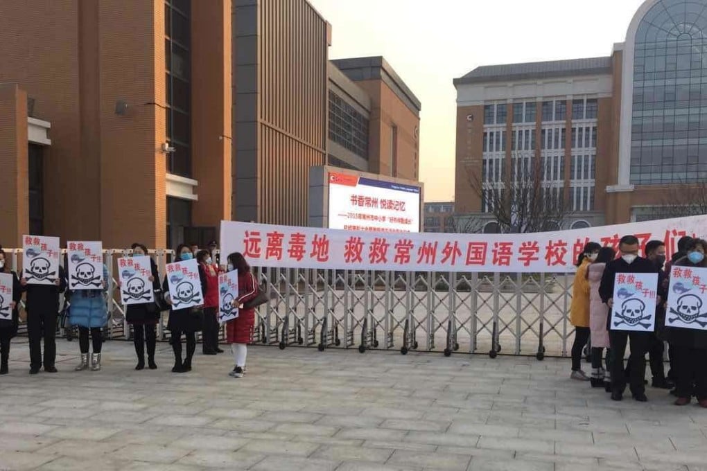 Parents demonstrate, demanding the relocation of the Changzhou Foreign Language School. File Photo