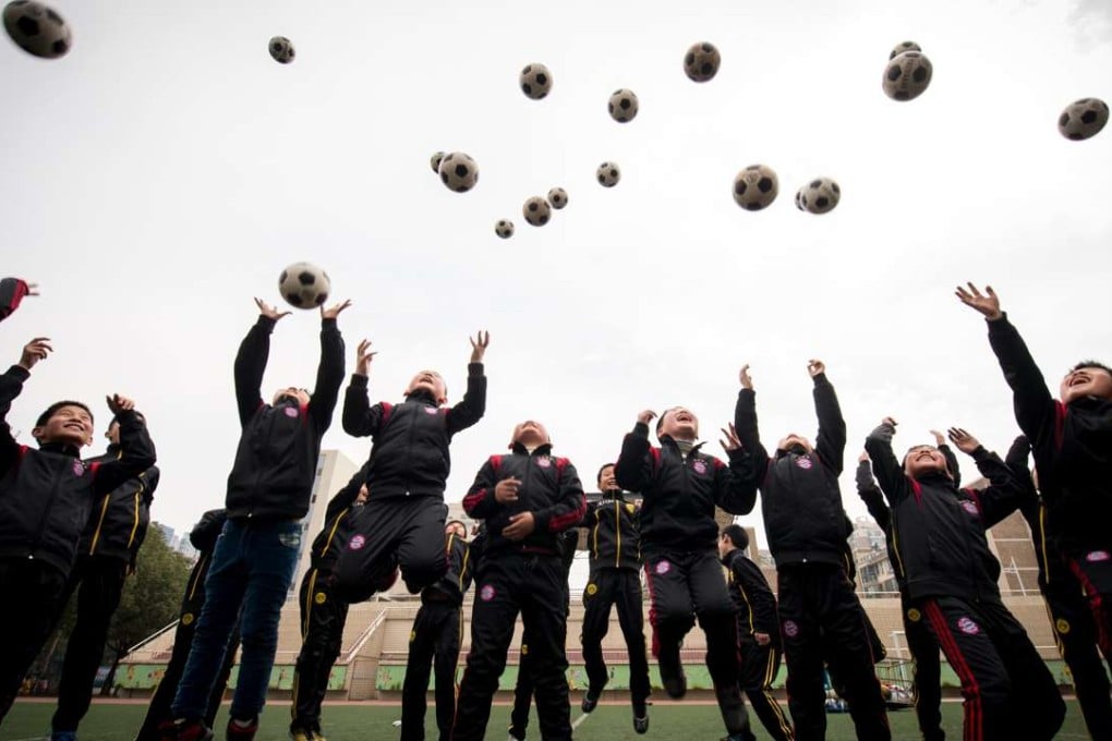 As part of the country’s drive for soccer excellence, more than 20,000 Chinese schools will include the sport in their curriculum by 2017. Photo: Xinhua