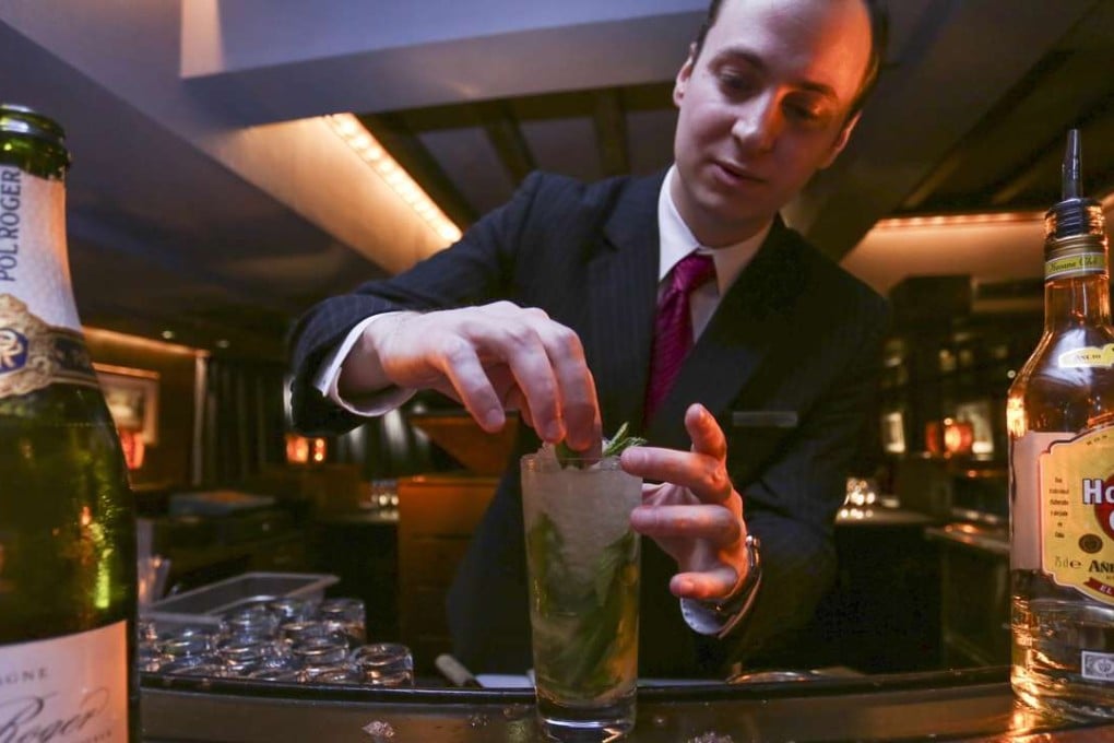 Grand Hyatt's Champagne Bar manager James Sandberg makes a Mojito Royale. Photos: Jonathan Wong