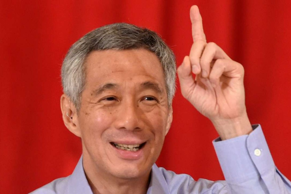 Singapore's Prime Minister Lee Hsien Loong gestures during a news conference on September 28, 2015. Photo: AFP