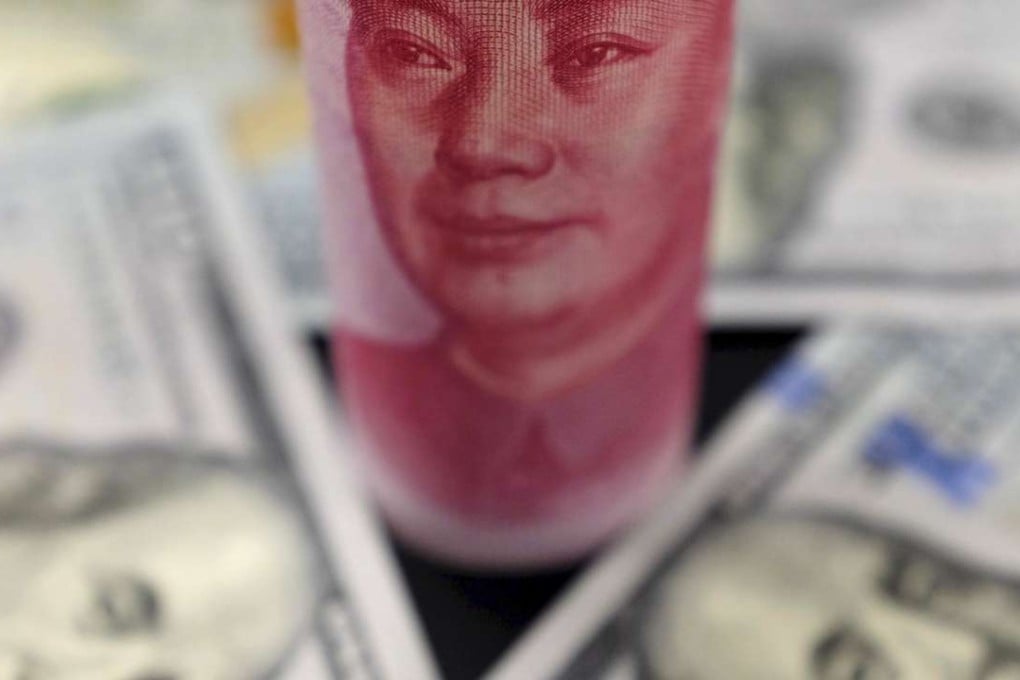 US 100 dollar banknotes and a Chinese 100 yuan note with the late Chinese Chairman Mao Zedong are seen as analysts feel it is time for Asia’s rich to start buying the greenback. Photo: Reuters