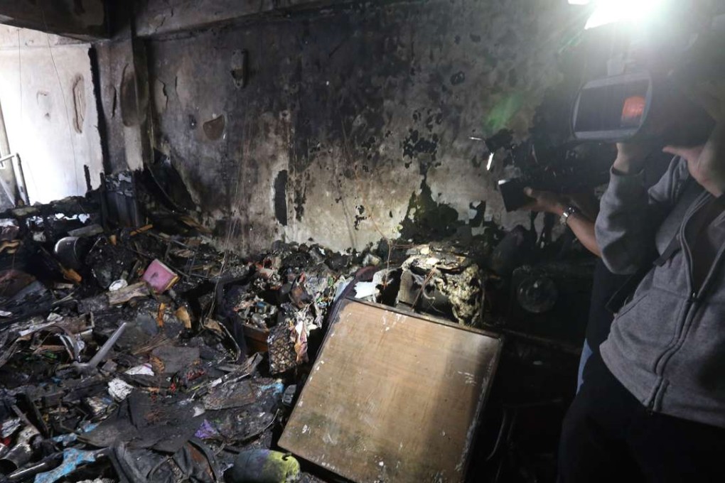 The charred remains of the eighth-floor flat in Wan Chai. Photo: Dickson Lee