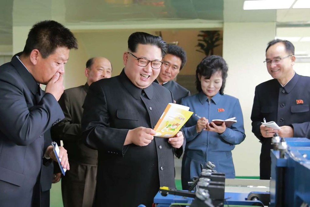 Kim Jong-un visiting the newly built Mindulle Notebook Factory. Photo: AFP
