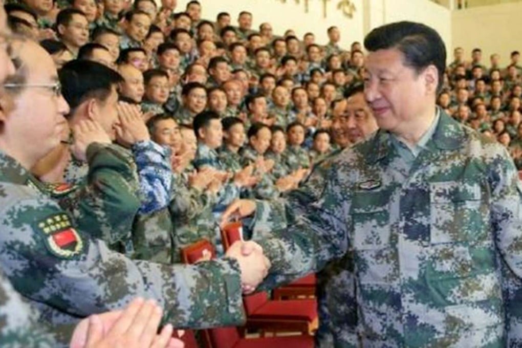 Xi Jinping wears a camouflage uniform at the PLA’s new joint operation command. File Photo