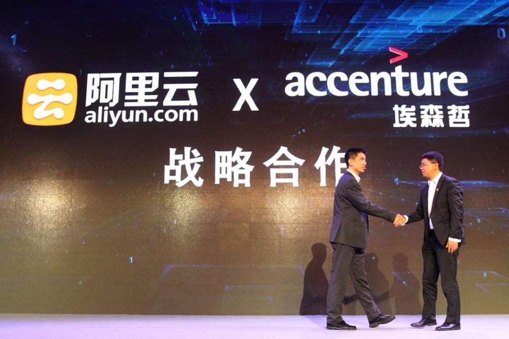 Sicheng Yu, Vice President of Alibaba Cloud shakes the hand of Yu Yi, Managing Director of Accenture Digital in Greater China as both firms announced they were partnering for business opportunities in China and Southeast Asia. Photo: Handout
