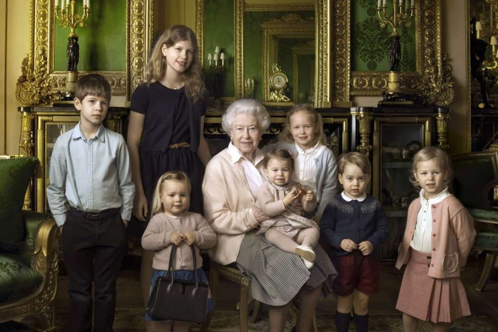 This official photograph, released by Buckingham Palace on Wednesday April 20, 2016, to mark her 90th birthday, shows Queen Elizabeth II with her five great-grandchildren and her two youngest grandchildren in the Green Drawing Room, part of Windsor Castle's semi-State apartments in Windsor England. Photo: AP