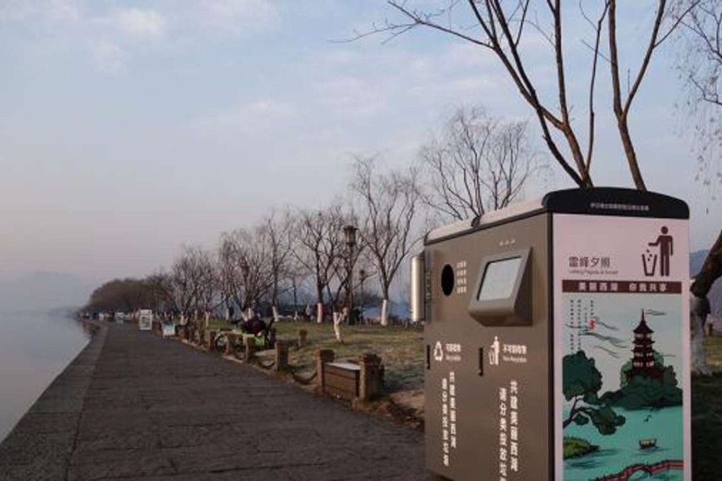 A scavenger reportedly pushed a new bin into Hangzhou’s West Lake after becoming frustrated that he could not reclaim a discarded can. Photo: Thepaper.cn