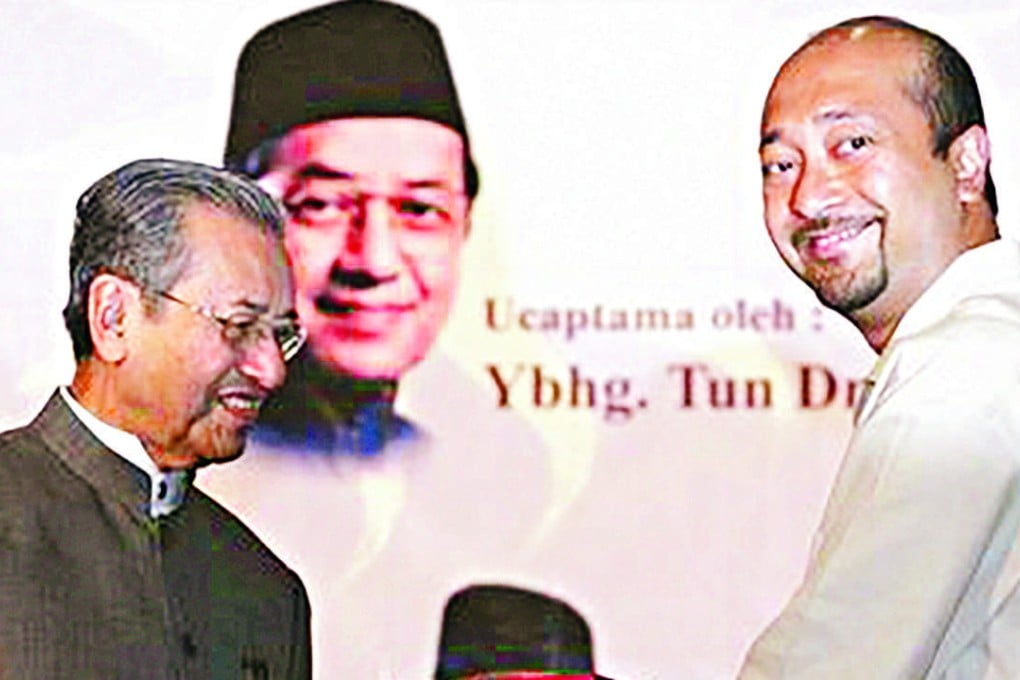 Mukhriz Mahathir (right) with his father, former Malaysian Prime Minister Mahathir Mohamad. Photo: Reuters