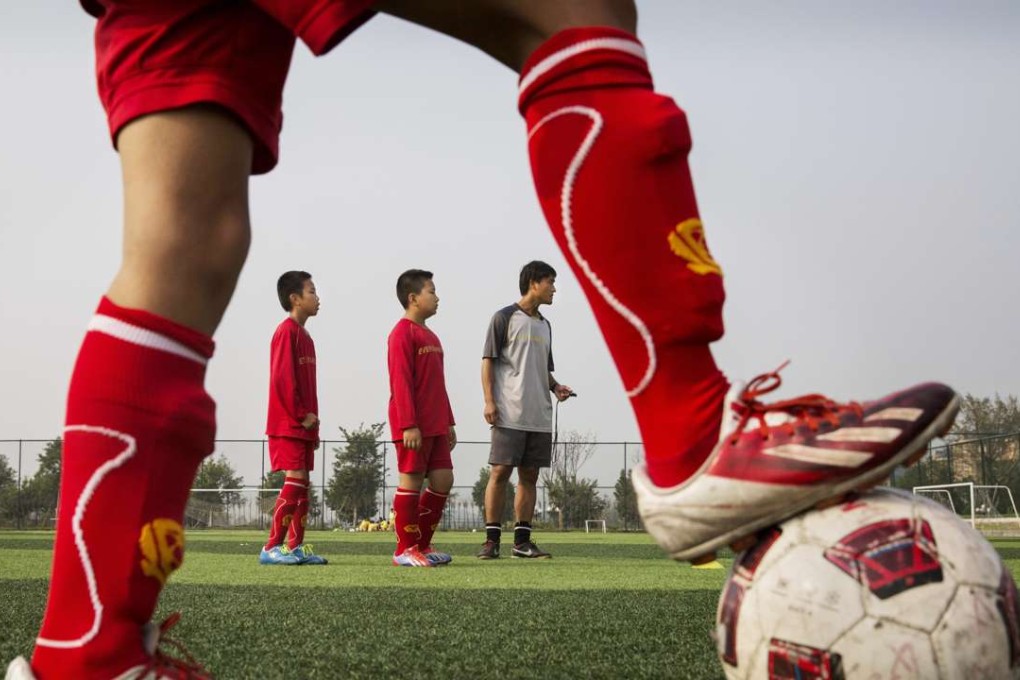 Pupils train at the Evergrande International Football School near Qingyuan in Guangdong province. Photo: Getty Images