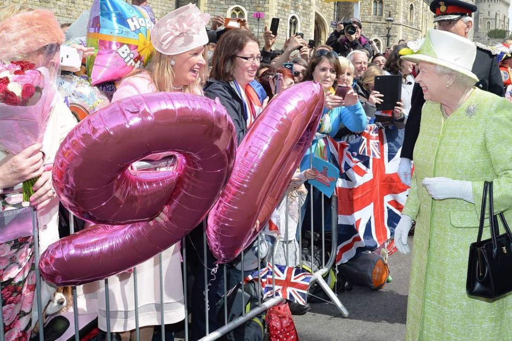 Britain's Queen Elizabeth greets well-wishers on her 90th birthday in Windsor, west of London, on Thursday. Photo: AFP