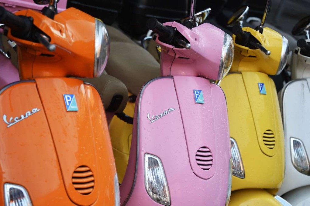 Vespa scooters of different colours. Photo: AFP