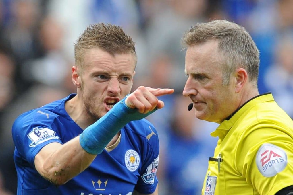 Leicester City’s Jamie Vardy points at referee Jonathan Moss after being sent off against West Ham. Photo: AP