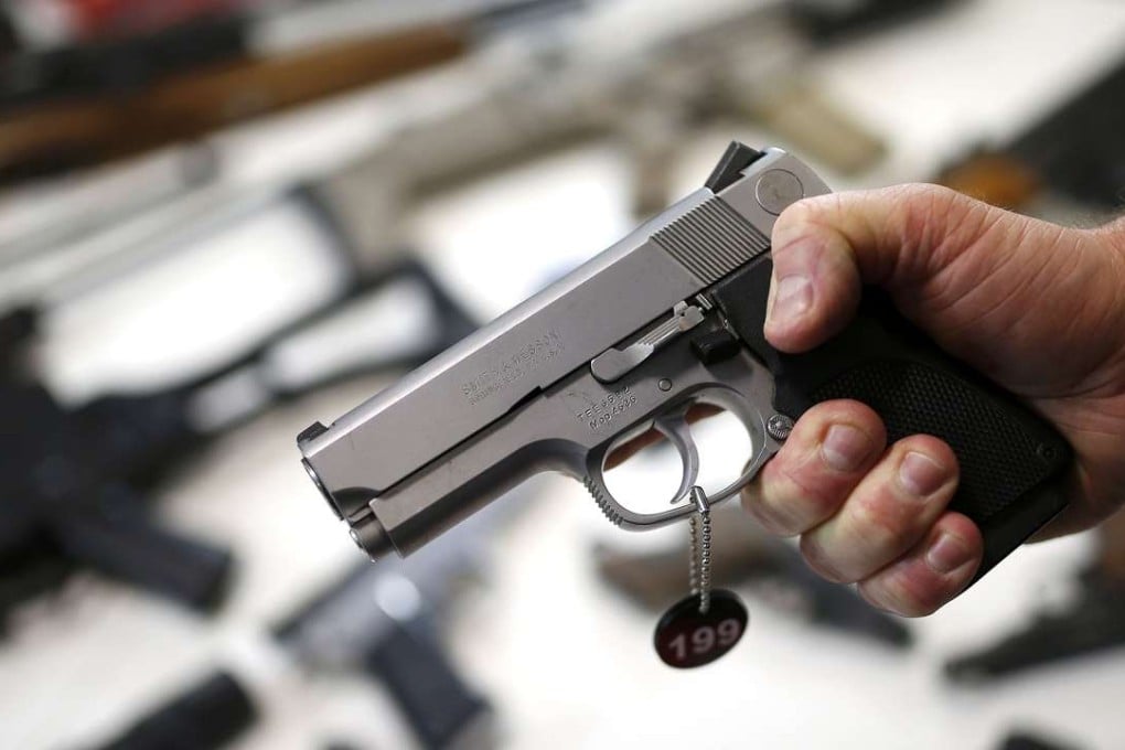 A police officer holding a gun. Photo: Reuters