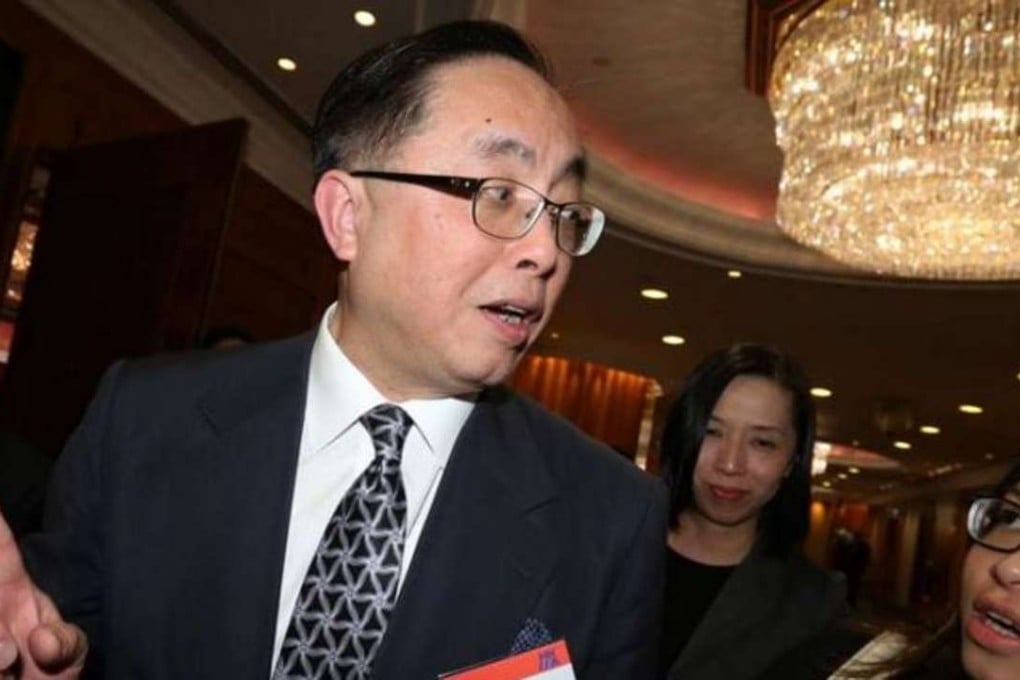 Innovation and technology minister Nicholas Yang being questioned by SCMP reporter Jeffie Lam about his share dealings and two BVI firms. Photo: Dickson Lee