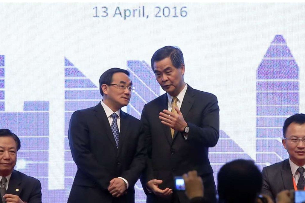 Chief Executive Leung Chun-ying and Cyberspace Administration deputy director Xu Lin (standing left) discuss the internet economy. Photo: Dickson Lee