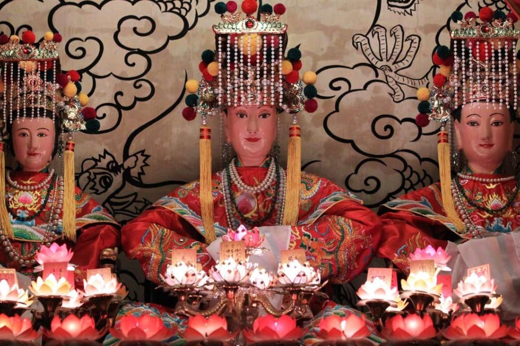 Candles illuminate statues of Tin Hau at the temple in Clear Water Bay ahead of the annual Tin Hau Festival to commemorate the birthday of the Goddess of the Sea. Photo: Dickson Lee
