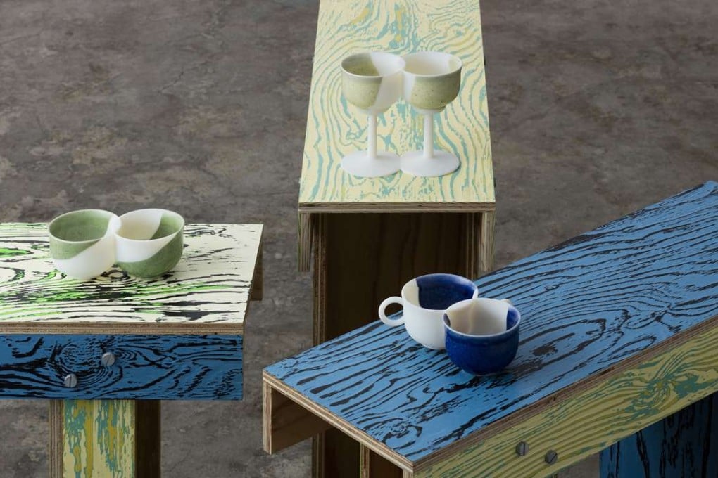 Jo Nagasaka updated the Japanese tradition of kintsugi using 3D scanning and printing techniques. His “twintsugi” cups and glasses sit on his ColoRing_shrine tables use an old Japanese woodcraft technique called udukuri to reveal tricoloured tree ring patterns. Photo: Takashi Mochizuki