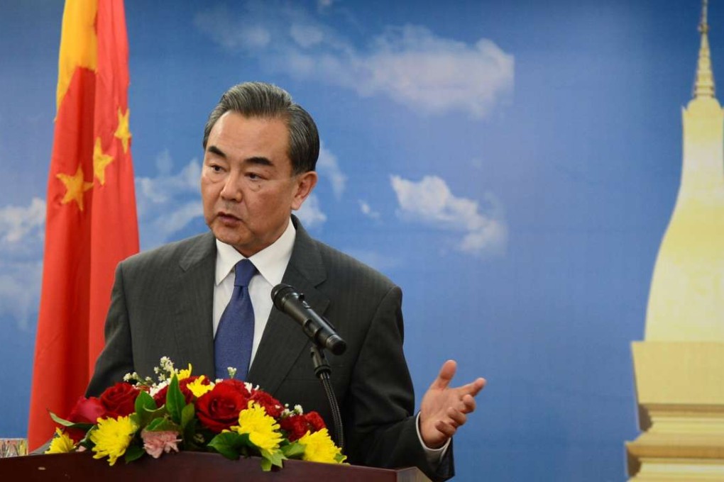 Chinese Foreign Minister Wang Yi addresses the media in Vientiane, Laos on Saturday. Photo: Xinhua