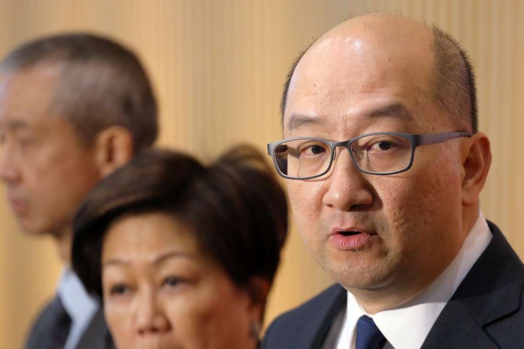 Tam speaking to local media at government headquarters in Tamar last month. Photo: Felix Wong