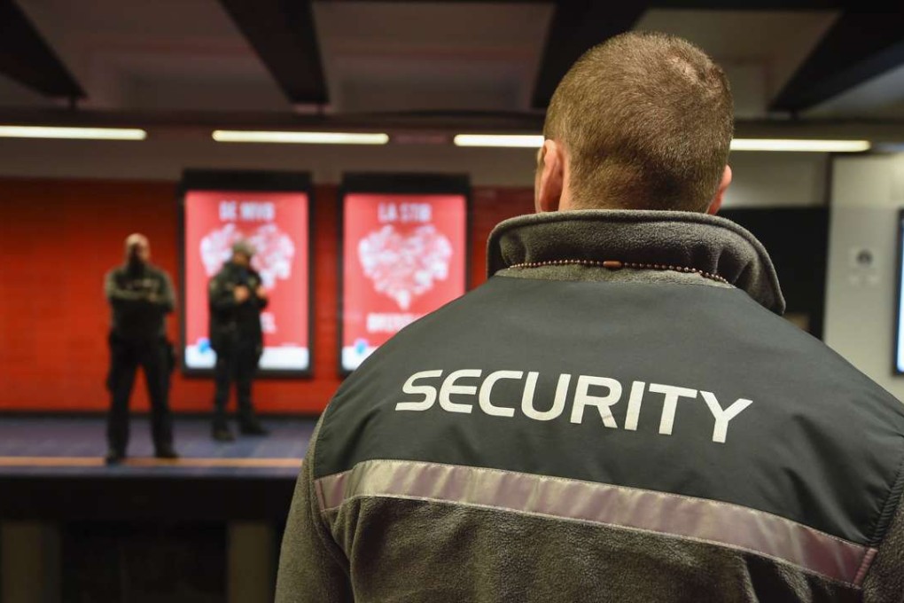 Security agents stand at the Maelbeek metro station in brussels. Photo: AFP