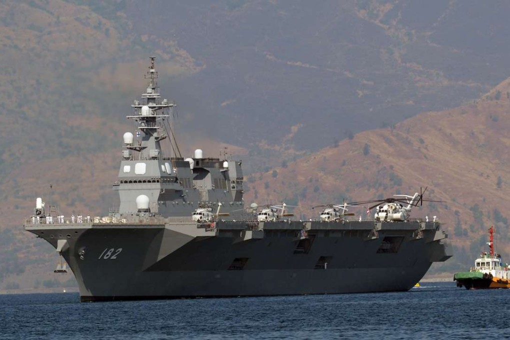 Japanese helicopter carrier Ise is towed as it prepares to dock at the former US naval base, Subic port, north of Manila on April 26, 2016. Photo: AFP