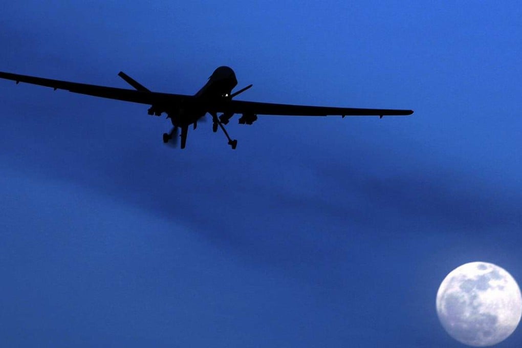 A US Predator drone flies over Kandahar Air Field, southern Afghanistan, on a moon-lit night. Photo: AP