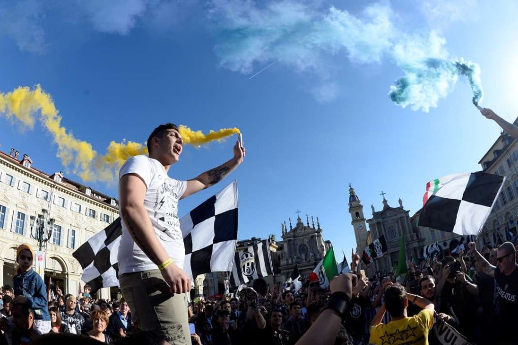 Juventus' supporters celebrate after their soccer club won the Serie A title. Photo: Reuters