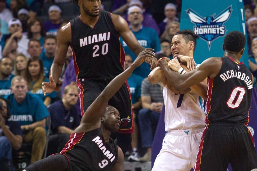Jeremy Lin fights for a ball with Josh Richardson and Luol Deng. Photo: USA Today Sports