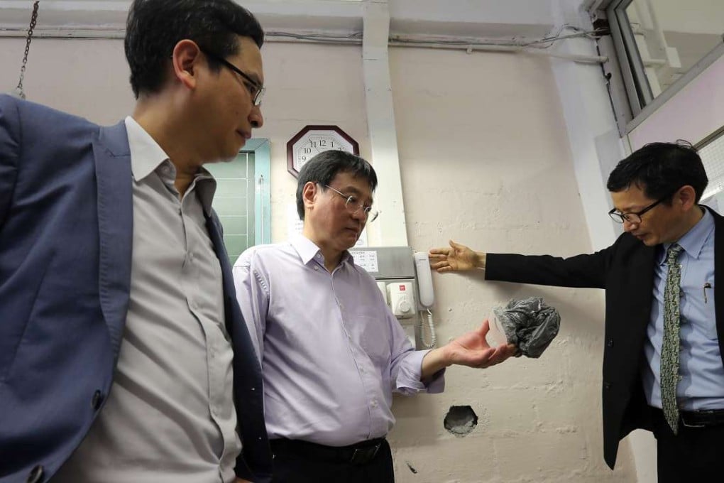 Ip Kin-yuen, deputy chairman of the Legislative Council’s education committee (left) visits one of the matchbox-style schools. Photo: Dickson Lee