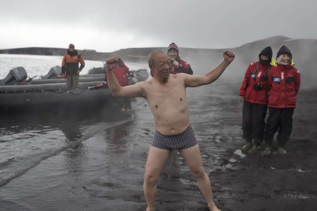 Tourists enjoy the hot springs of the crater lake of Deception Island, Antarctica. Prior to 1966, human activity in Antarctica was limited to the early explorers, those seeking fortune in the exploitation of seals and whales, and more recently to scientific research and exploration. Photo: AFP