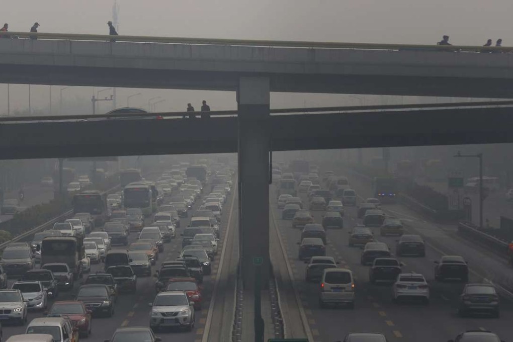 Vehicles travel through a main thoroughfare during a smoggy day in Beijing on April 13, 2016. The Chinese Ministry of Environmental Protection received about 15,000 public complaints about pollution in 2015. The air pollution tip-offs became the top 78.3 per cent of all complaints received through the ministry's hotline and 68 per cent through the WeChat, according to the media reports. Photo: EPA