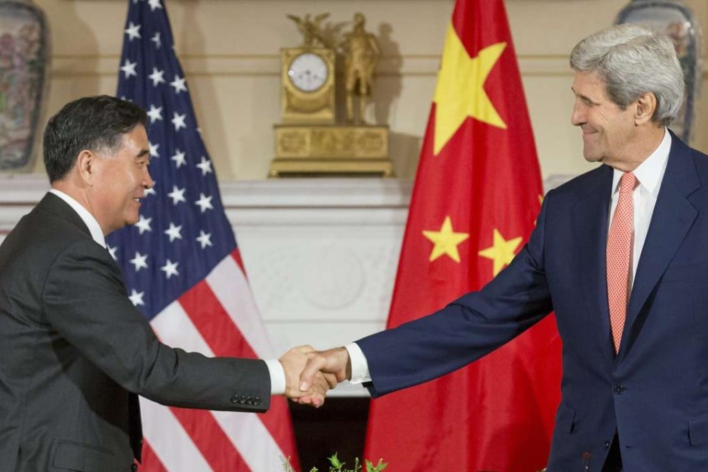 Chinese Vice-Premier Wang Yang (left) shakes hands with US Secretary of State John Kerry at the strategic and economic talks in Washington last June. Photo: EPA