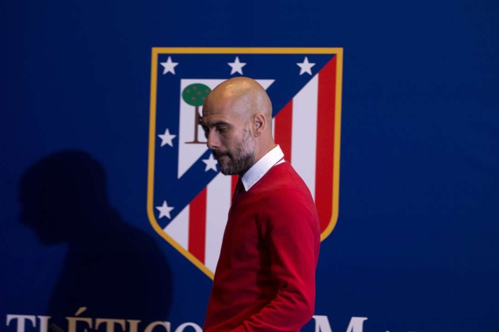 Bayern boss Pep Guardiola arrives for a news conference at the Vicente Calderon stadium in Madrid. photo: AP