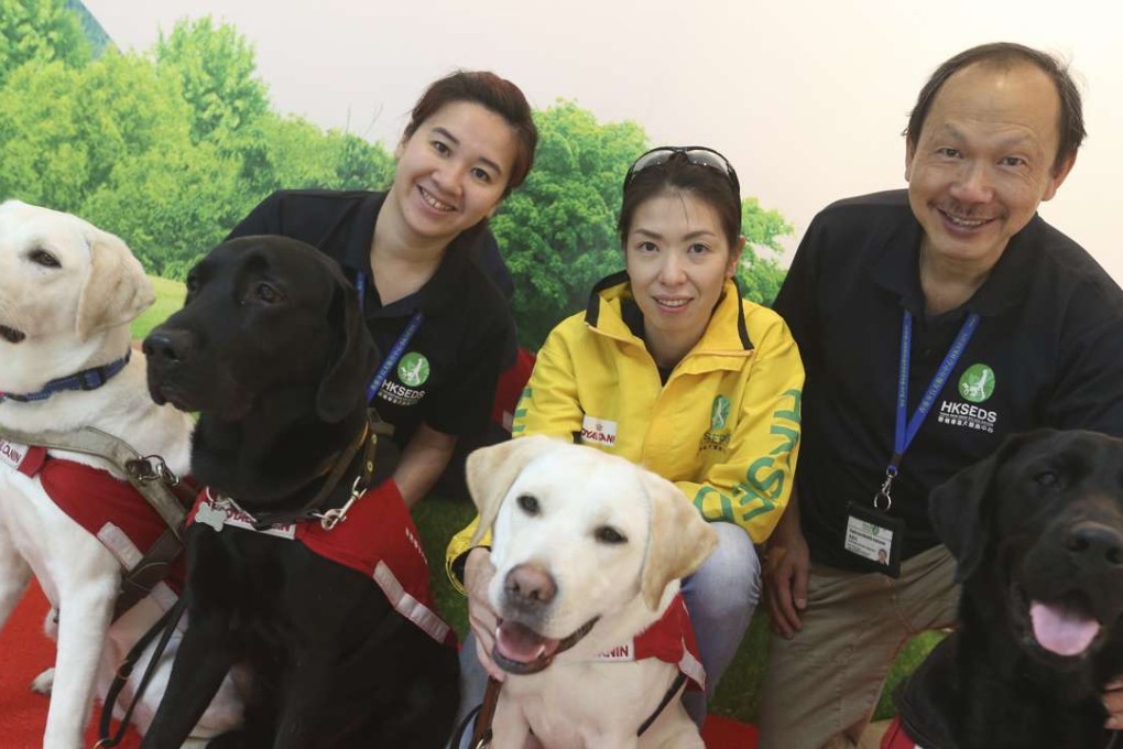 Guide dog trainers (from left) Brenda Pang, Edith Lee Yuen-yan and Raymond Cheung, at Hong Kong Seeing Eye Dog Services, Kwai Chung. Photo: K. Y. Cheng