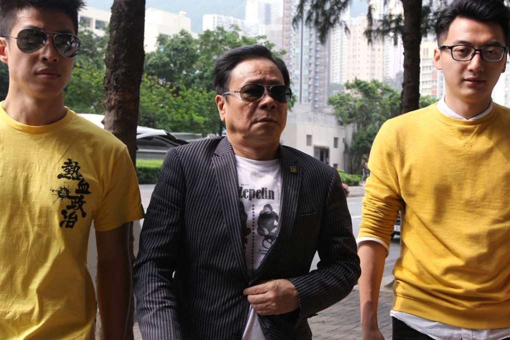 Lawmaker Wong Yuk-man (centre) arrives at Eastern Court. Photo: Bruce Yan