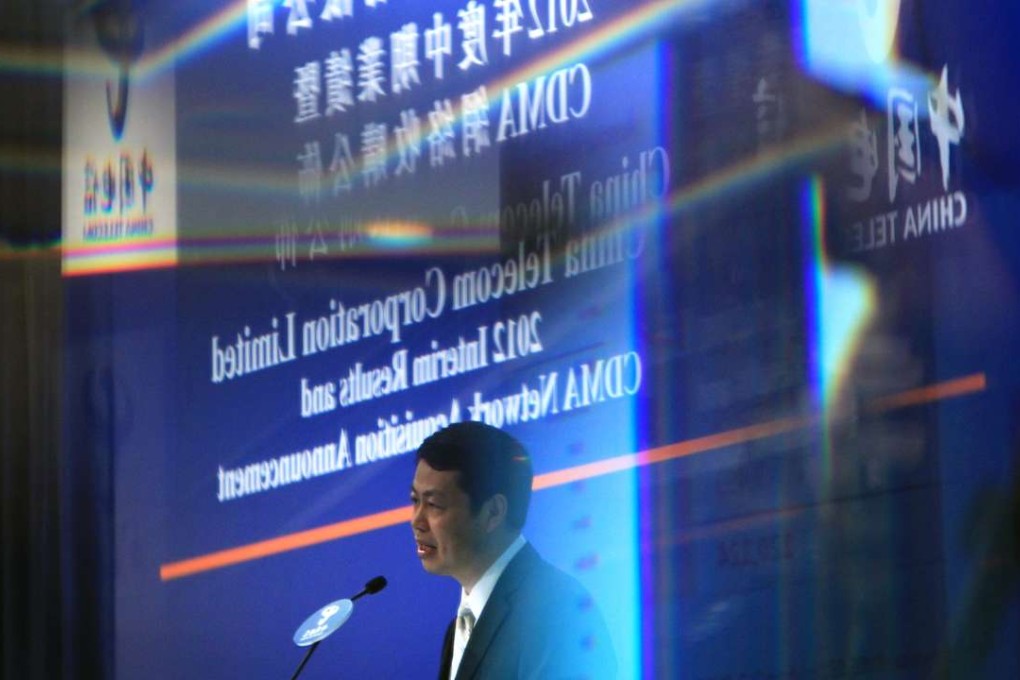 A file photo of China Telecom Chief Executive Yang Jie speaking at the companys 2012 interim results announcement. Photo: Jonathan Wong