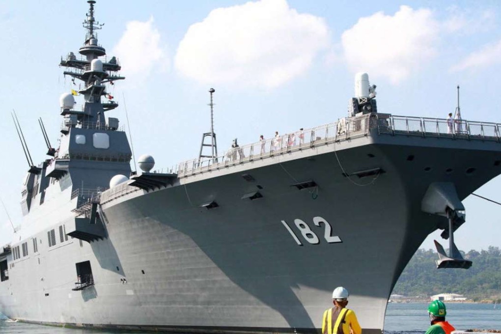 Japanese helicopter carrier Ise dock at the former US naval base, Subic port, in the Philippines on Tuesday. Four Asean members – the Philippines, Vietnam, Malaysia and Brunei – have rival claims to parts of the sea with China. Photo: EPA