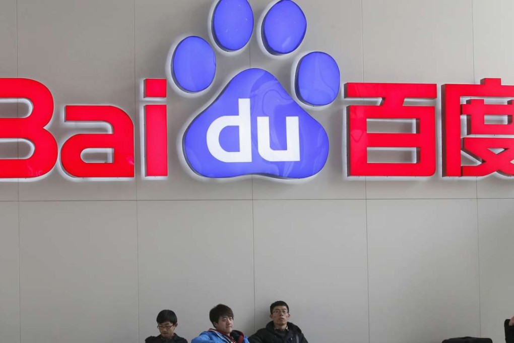 People sit in front of the company logo of Baidu at its headquarters in Beijing. Photo: Reuters