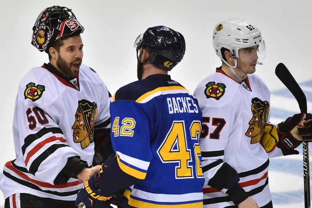 The St Louis Blues’ David Backes shakes hands with Blackhawks goalie Corey Crawford after Chicago are eliminated in game seven of the first round of the 2016 Stanley Cup play-offs. The Blackhawks lost eight of the 20 players from their championship roster the previous season because of the salary cap. Photo: USA Today Sports