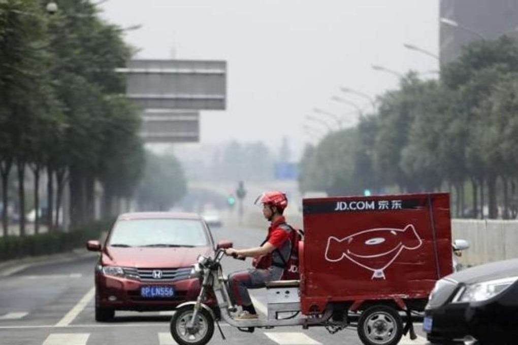 An internet shopping delivery cycle on the streets of Beijing. Photo: Reuters