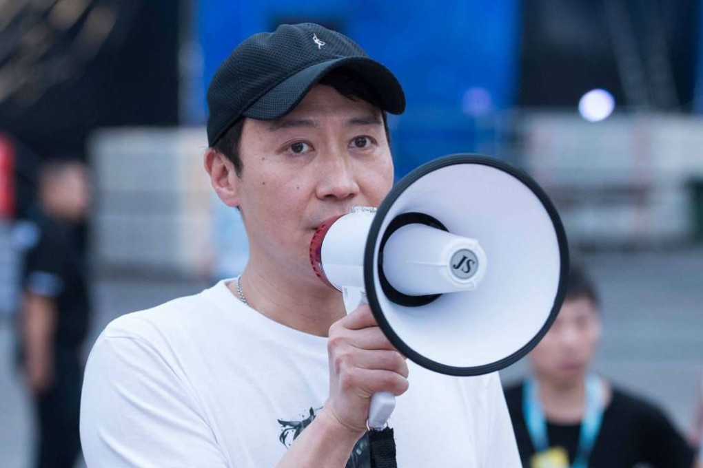 The Canto-pop idol was at the scene with a hand-held megaphone to announce the concert was cancelled and apologised for his team not meeting safety standards. Photo: Robert Ng